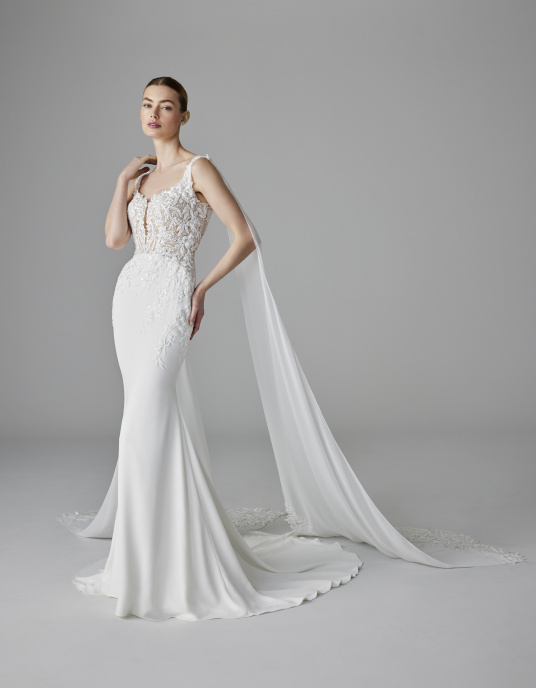 Robes de mariées  Pronovias ALIX sophistiquée et séduisante. Cette robe sirène présente un corsage en dentelle avec un décolleté en cœur et de fines bretelles 